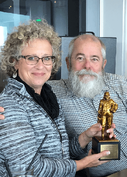 FootJoy Senior Director Maria Bonzagni and Taylor Box President Dan Shedd share the Premier Print Award